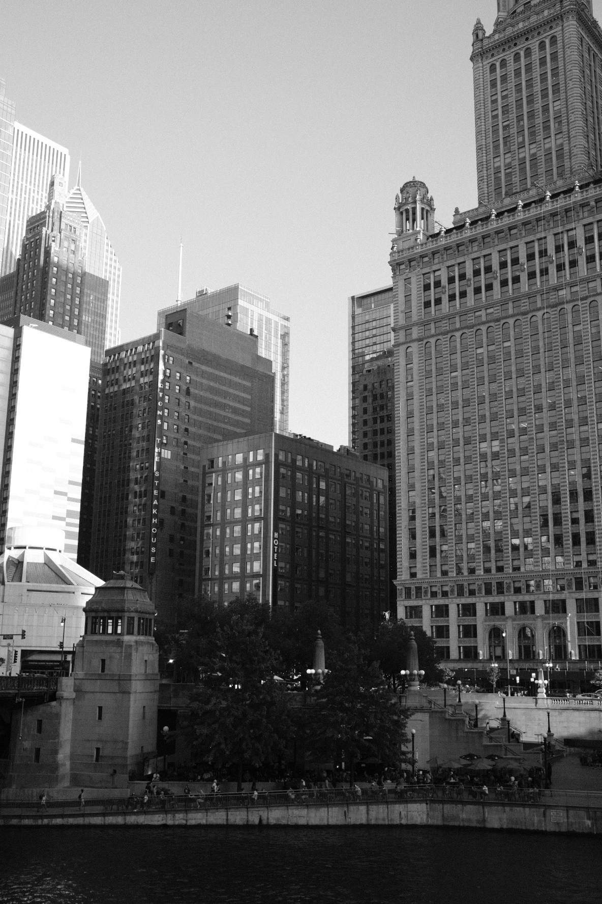 Black-and-white towers lining a city river